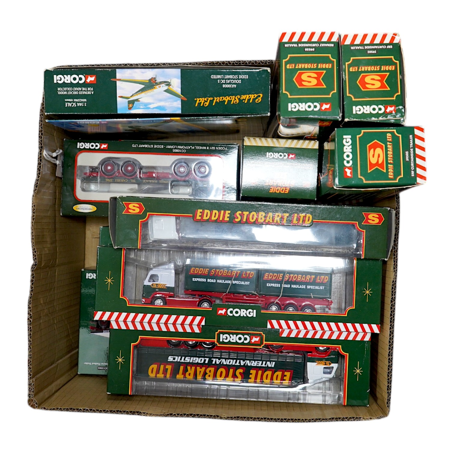 Fourteen boxed Corgi diecast Eddie Stobart commercial vehicles, including articulated tractor and trailer units, a Douglas DC-3 aircraft, flatbed lorries, etc. Condition - good.